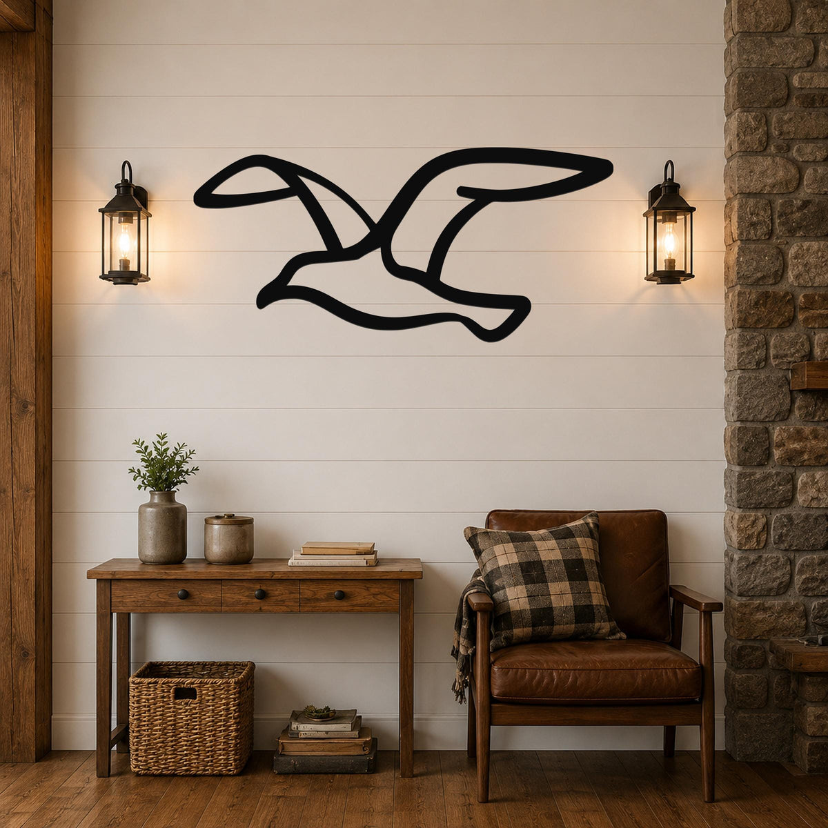 Black metal seagull wall art with motion-line cutouts, mounted on a shiplap wall above a wooden console table in a living room.