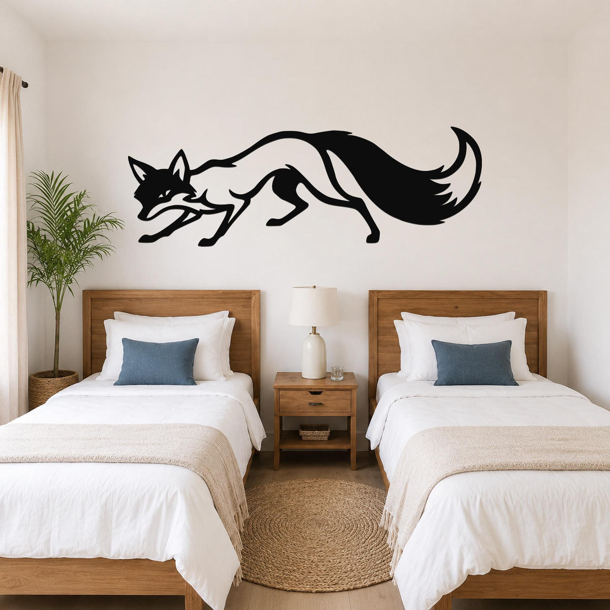 Black metal fox wall art silhouette with motion lines, mounted above two twin beds in a bedroom.