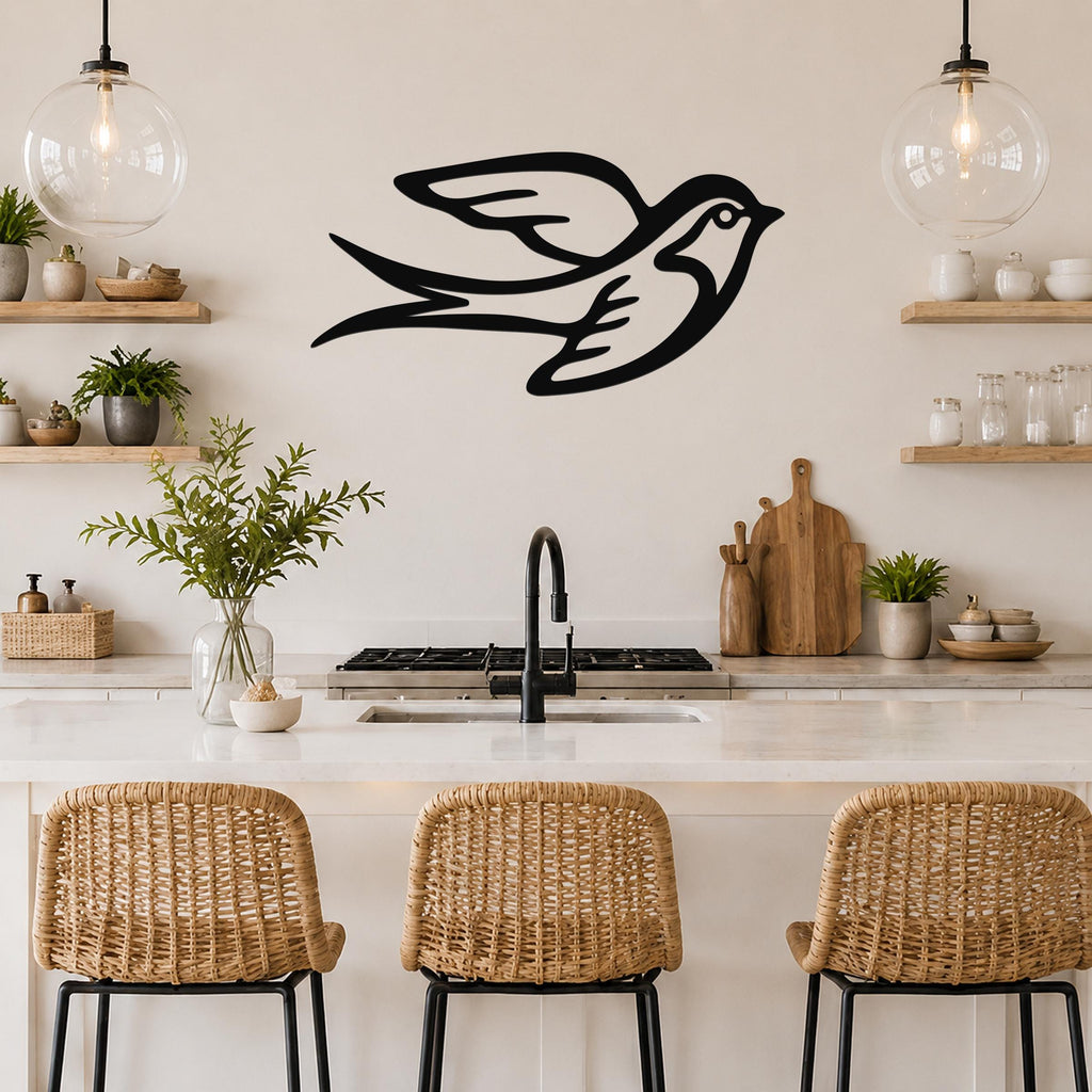 Black metal swallow bird wall art with motion-line cutouts, mounted above a kitchen counter in a modern kitchen.