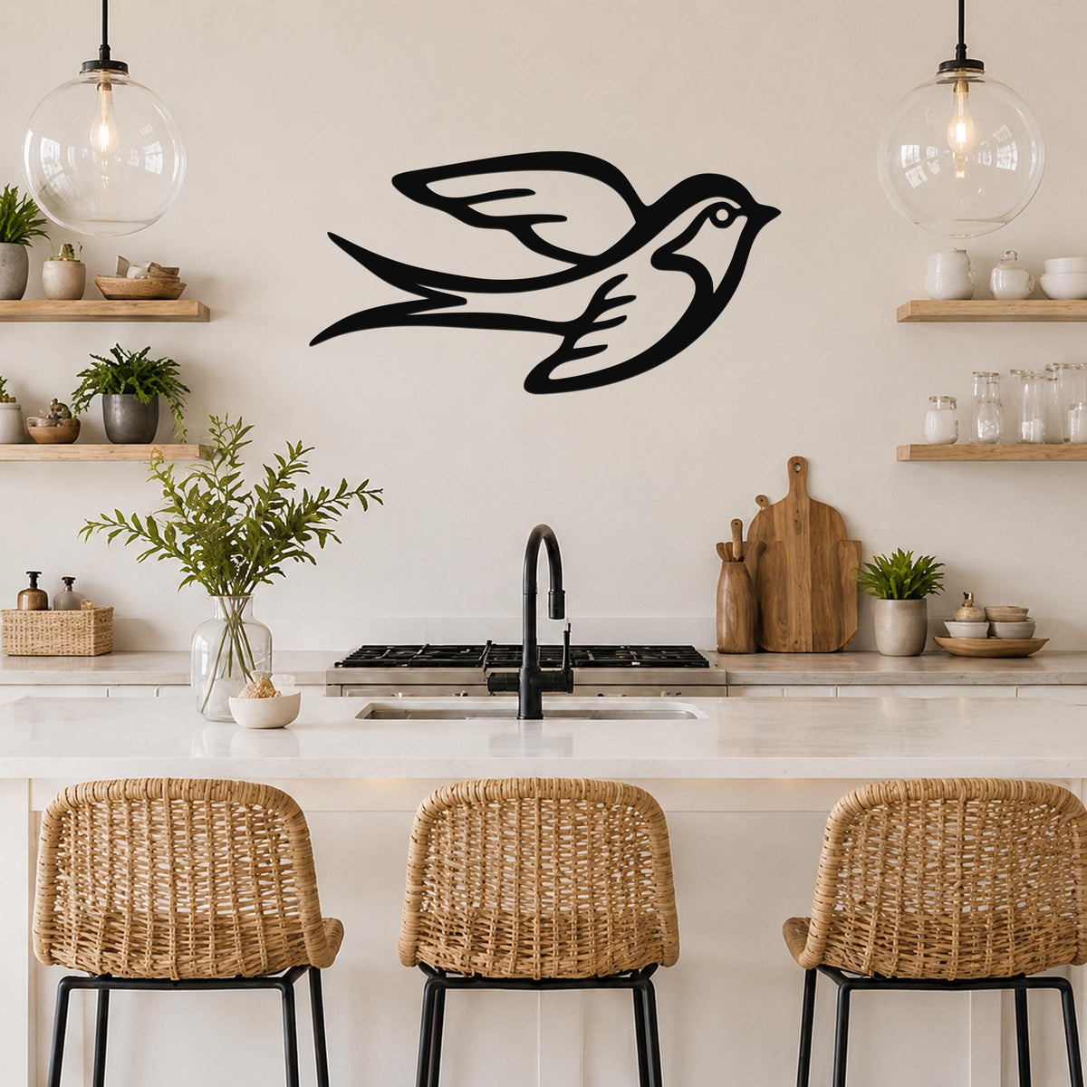 Black metal swallow bird wall art with motion-line cutouts, mounted above a kitchen counter in a modern kitchen.