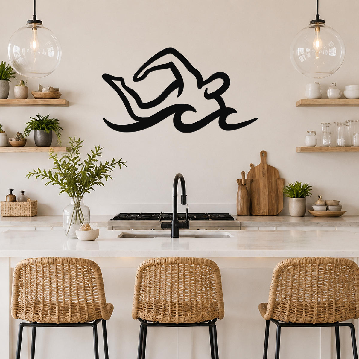 Black metal swimmer wall art with fluid motion lines, mounted above a kitchen counter in a modern kitchen.
