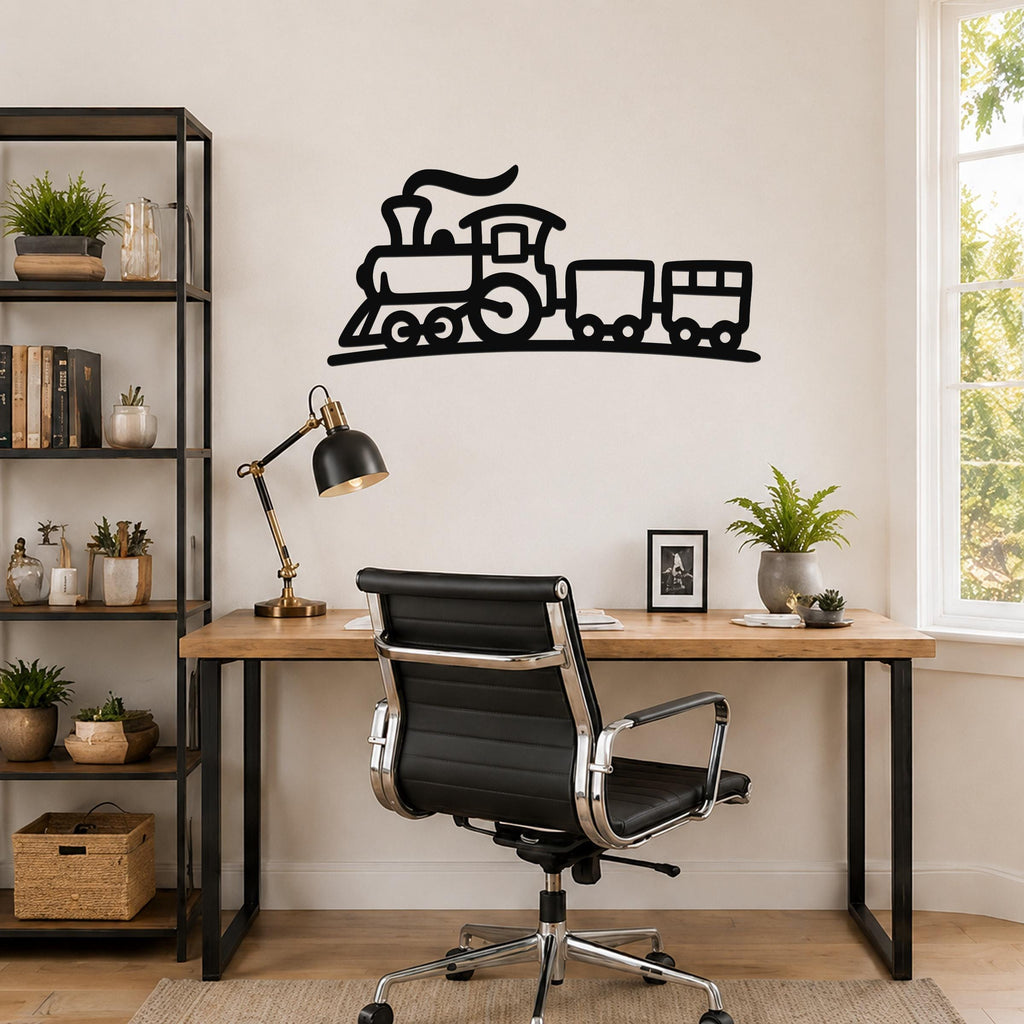 Black metal train wall art silhouette with smoke and wheels, mounted above a wooden desk in a home office.