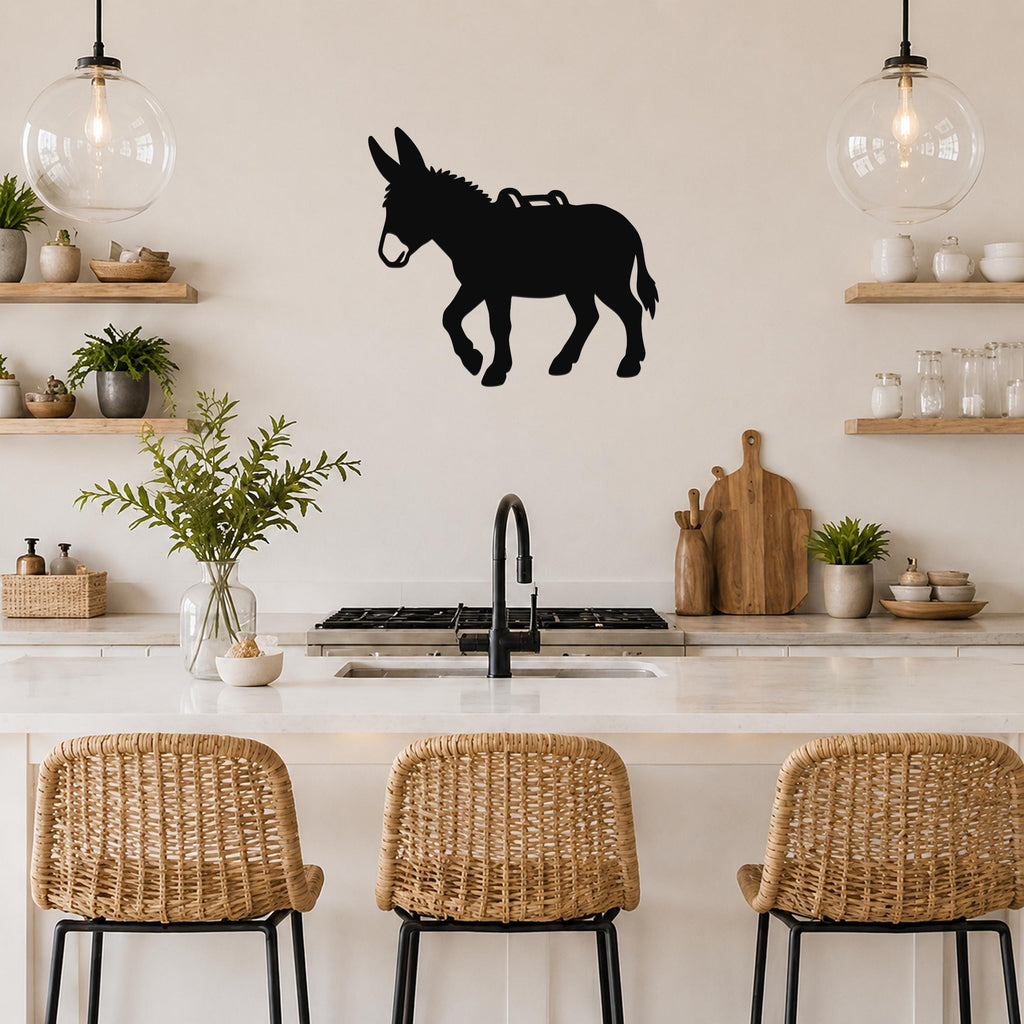 Black metal burro silhouette wall art with saddle cutout, mounted on a kitchen wall above a counter.