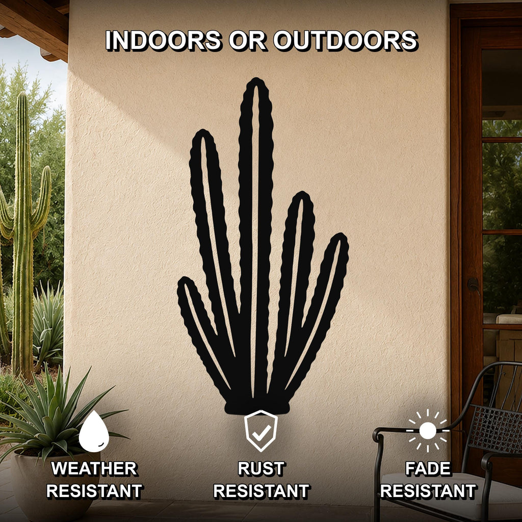 Black metal organ pipe cactus wall art with multiple vertical arms and internal cutouts, mounted on an outdoor patio wall above a potted plant.