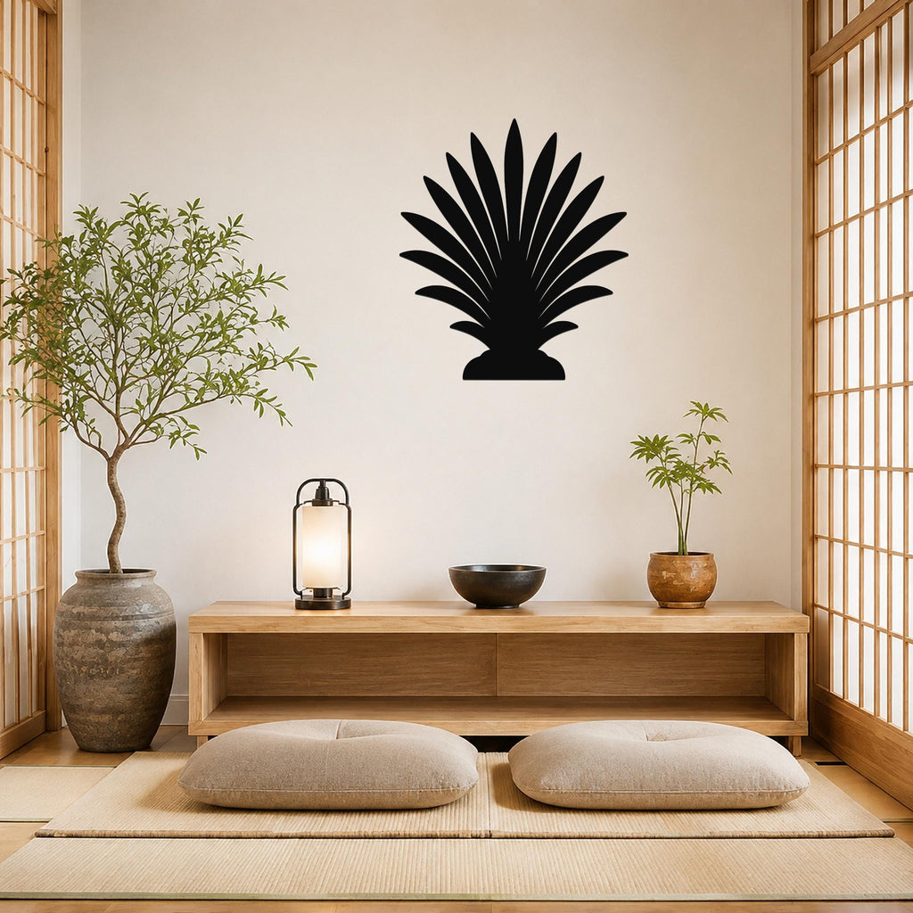 Black metal palm tree wall art with fan-shaped fronds, mounted on a wall above a wooden console in a minimalist living room.
