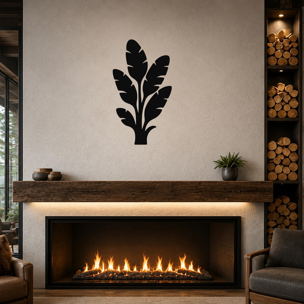 Black metal tropical leaves wall art silhouette mounted above a fireplace in a living room.