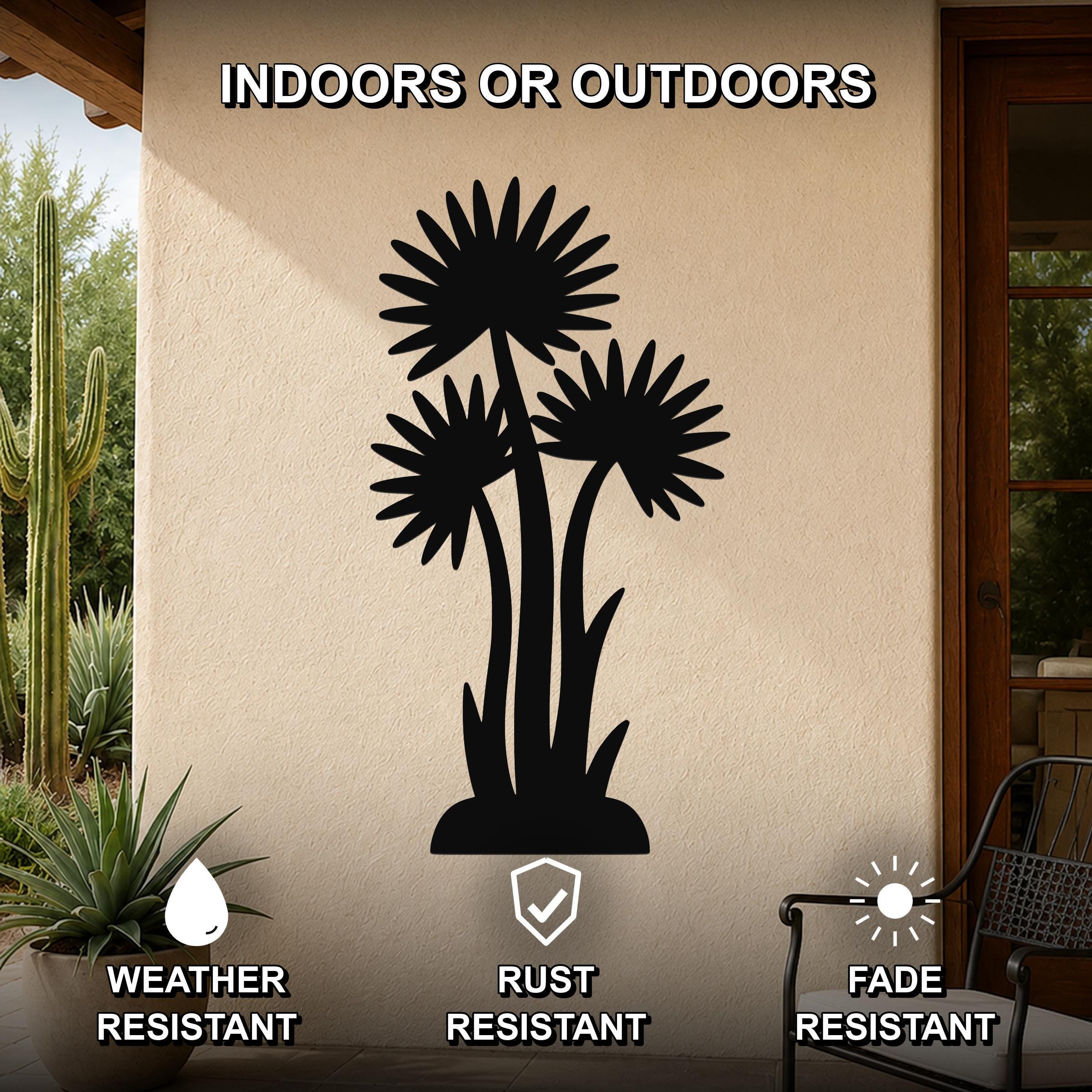 Black metal wall art featuring a silhouette of three wildflowers with radiating petals, mounted on an outdoor patio wall, weather resistant, rust resistant, and fade resistant.