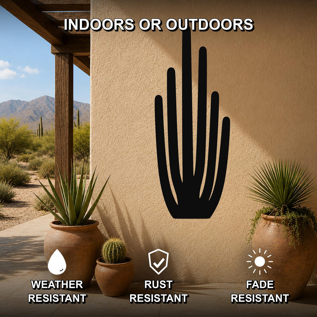 Black metal organ pipe cactus wall art with vertical spine cutouts, mounted on an outdoor patio wall above potted plants.