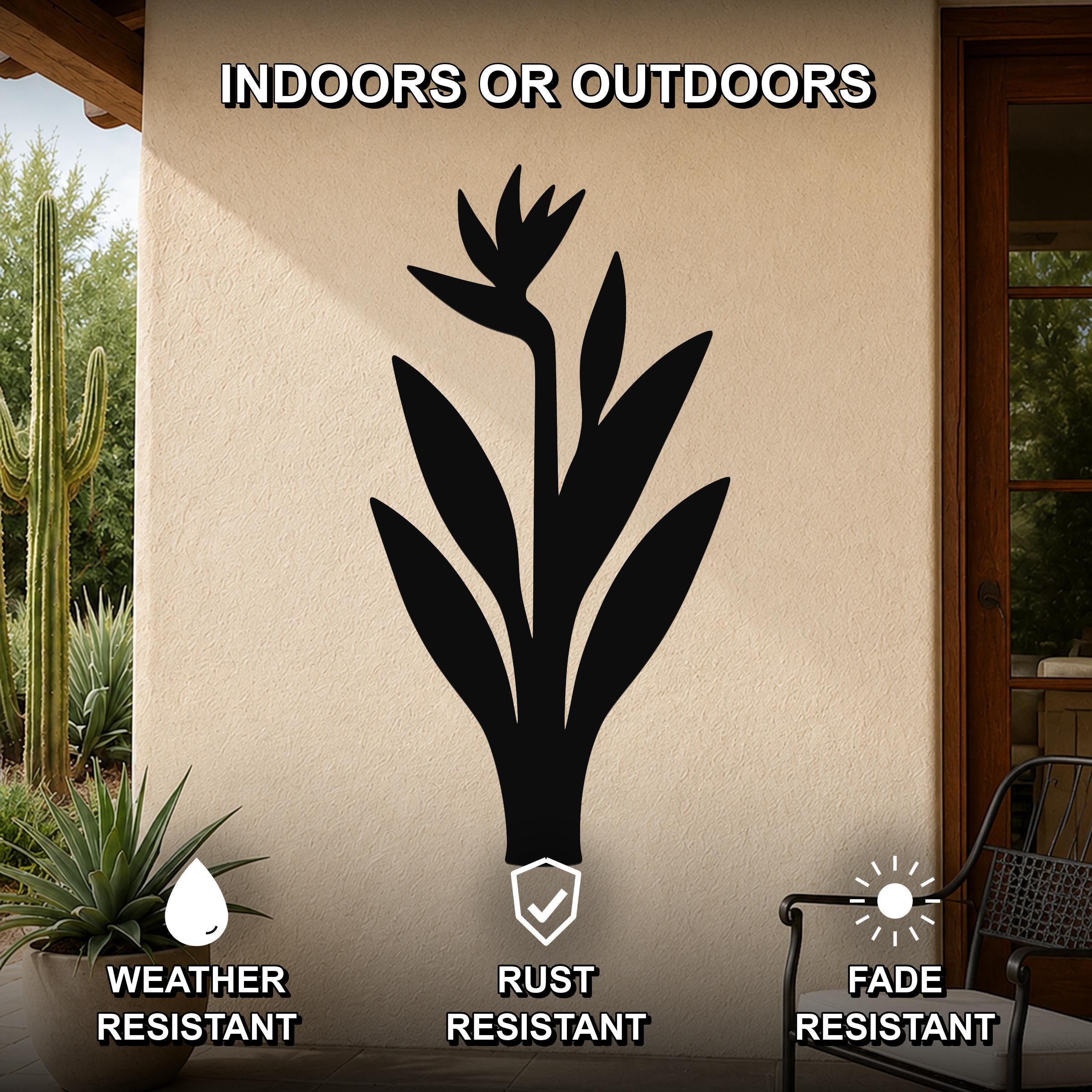 Black metal Bird of Paradise wall art silhouette mounted on an outdoor patio wall, weather resistant, rust resistant, and fade resistant.