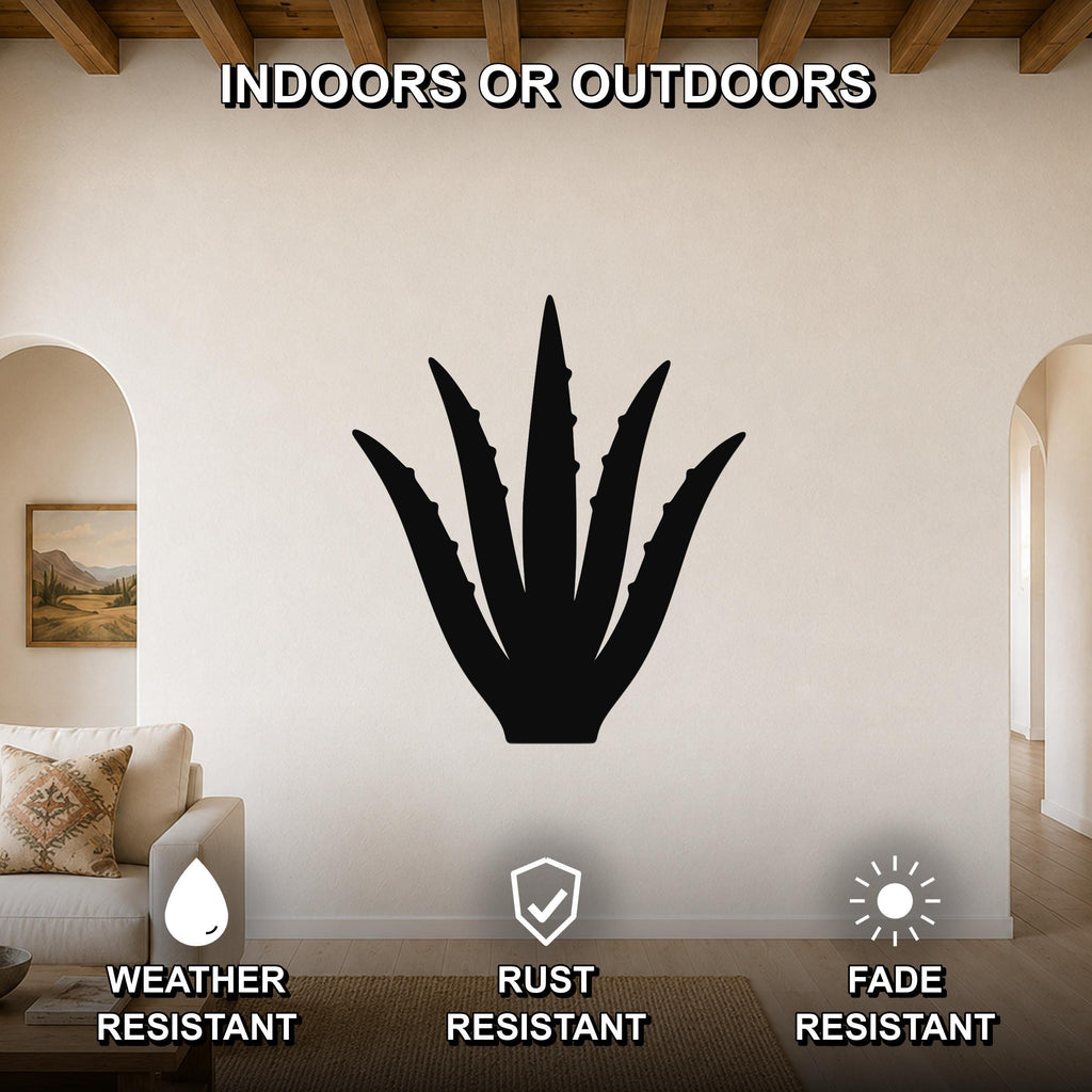Black metal agave wall art silhouette mounted on a living room wall above a sofa, featuring weather, rust, and fade resistant properties.