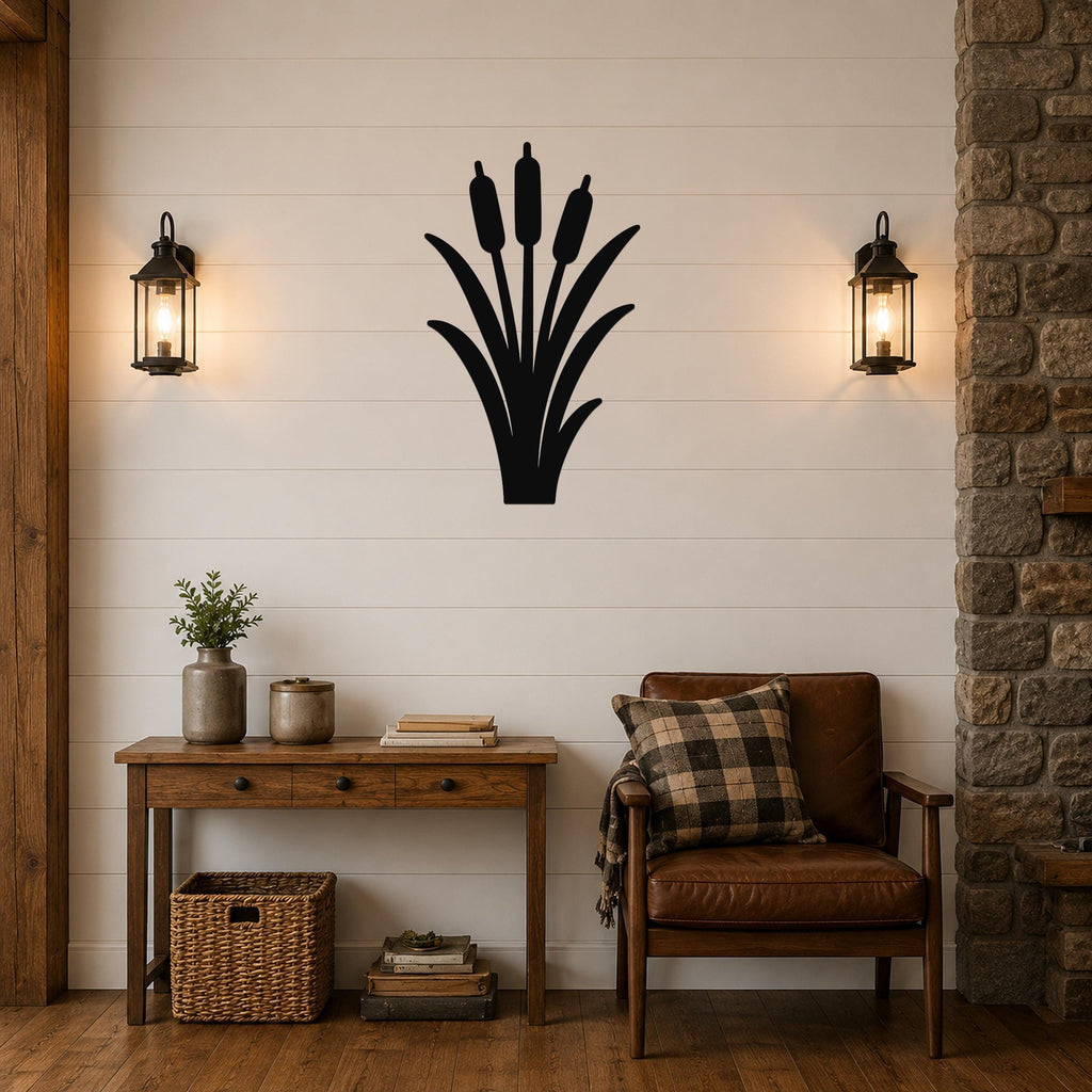 Black metal cattail wall art silhouette mounted on a shiplap wall above a wooden console table in a living room.