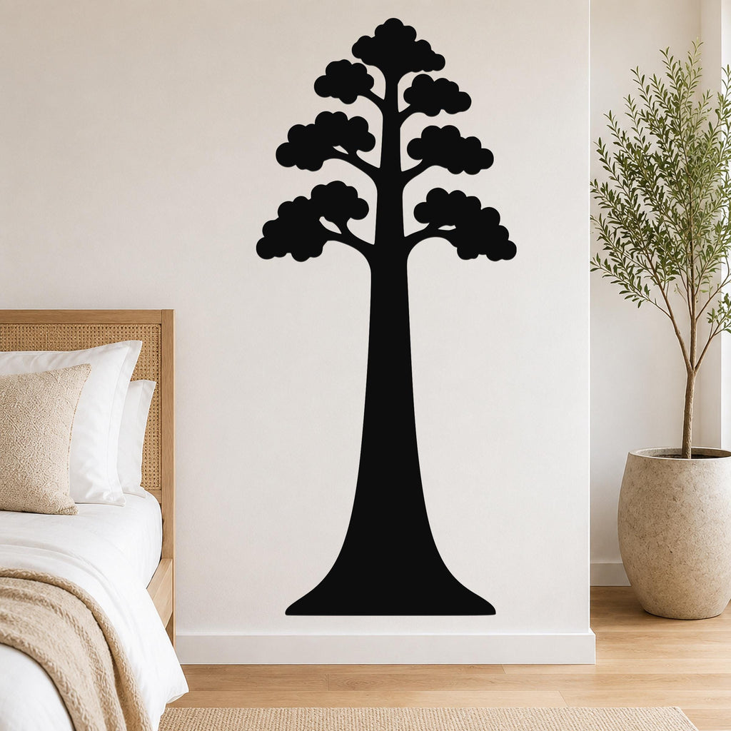 Black metal wall art of a sequoia tree silhouette with layered canopy, mounted on a bedroom wall above a bed.