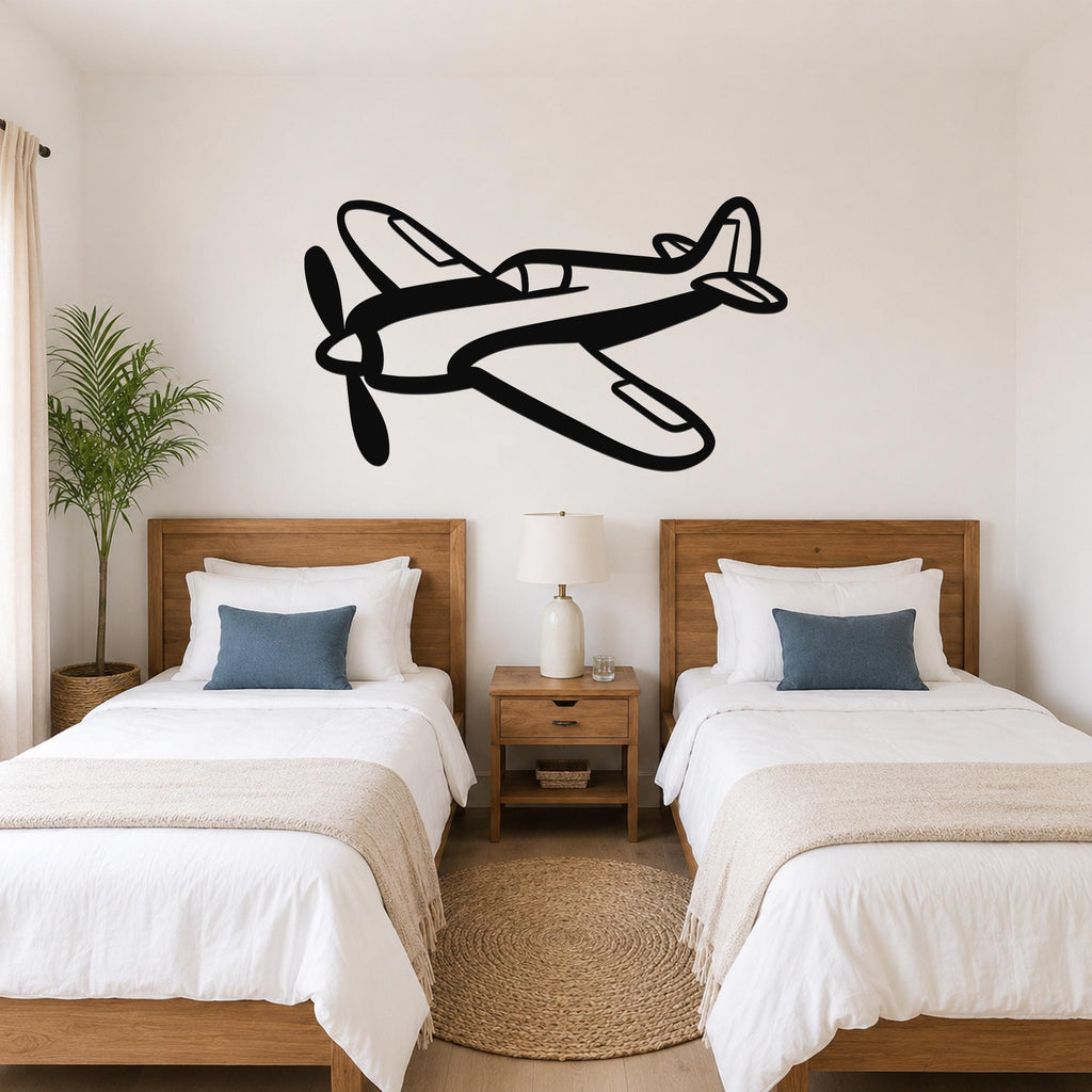 Black metal airplane wall art with a bold silhouette design, mounted above two twin beds in a bedroom.