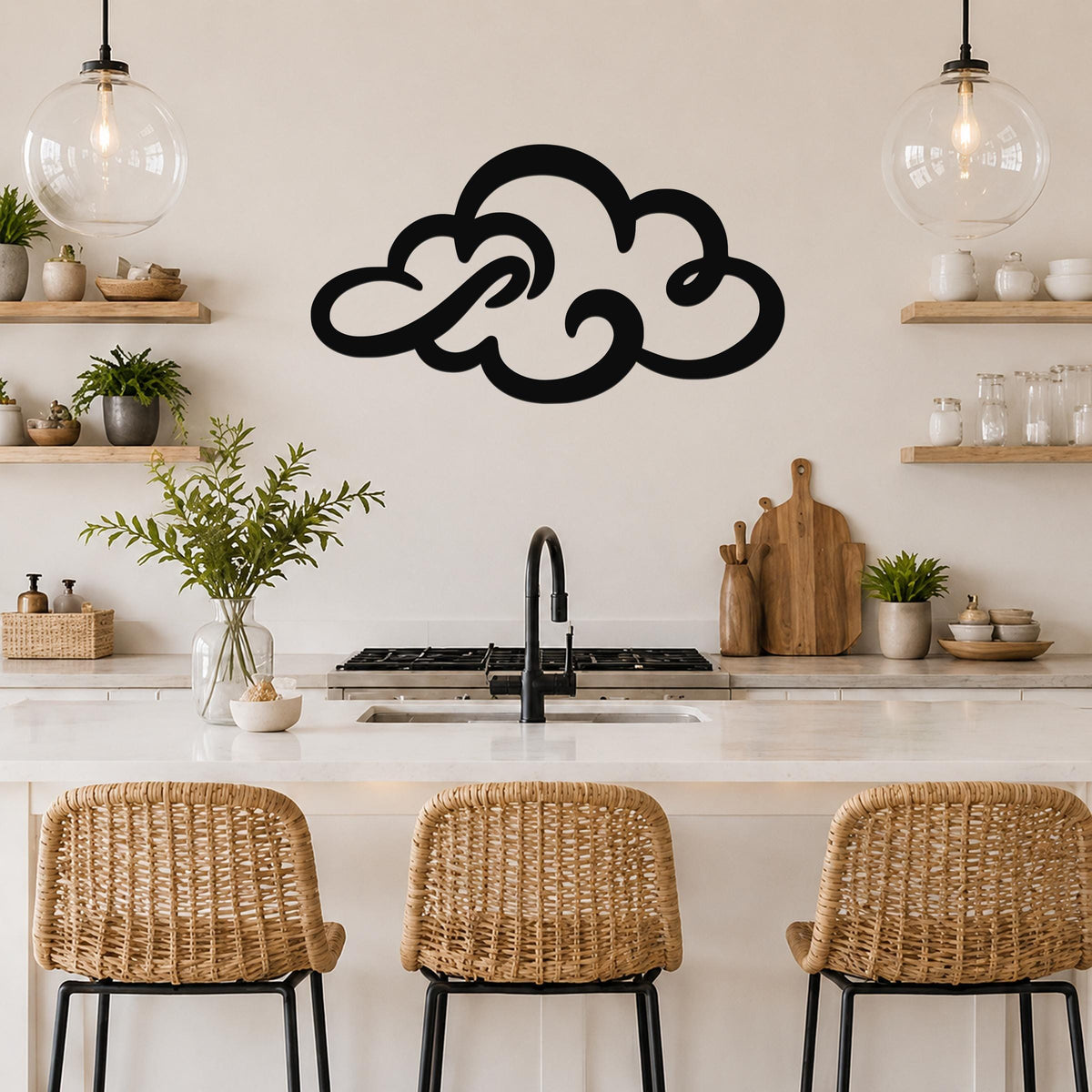 Black metal cloud wall art with flowing silhouette cutouts, mounted above a kitchen counter with wicker bar stools.