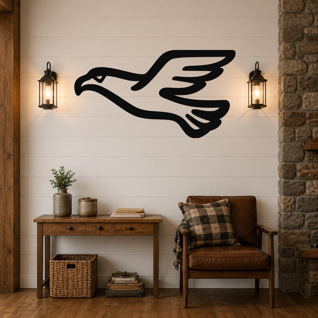 Black metal eagle wall art with a soaring silhouette, mounted on a shiplap wall above a wooden console table in a rustic living room.