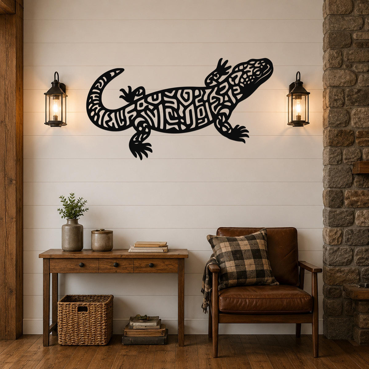 Black metal wall art of a Gila monster with intricate internal cutouts, mounted on a shiplap wall above a wooden console table in a living room.