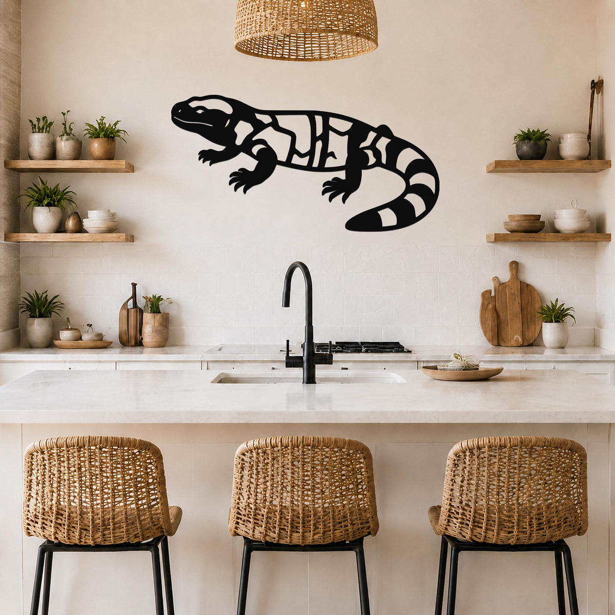 Black metal Gila monster wall art with internal cutout patterns, mounted on a kitchen wall above a counter.