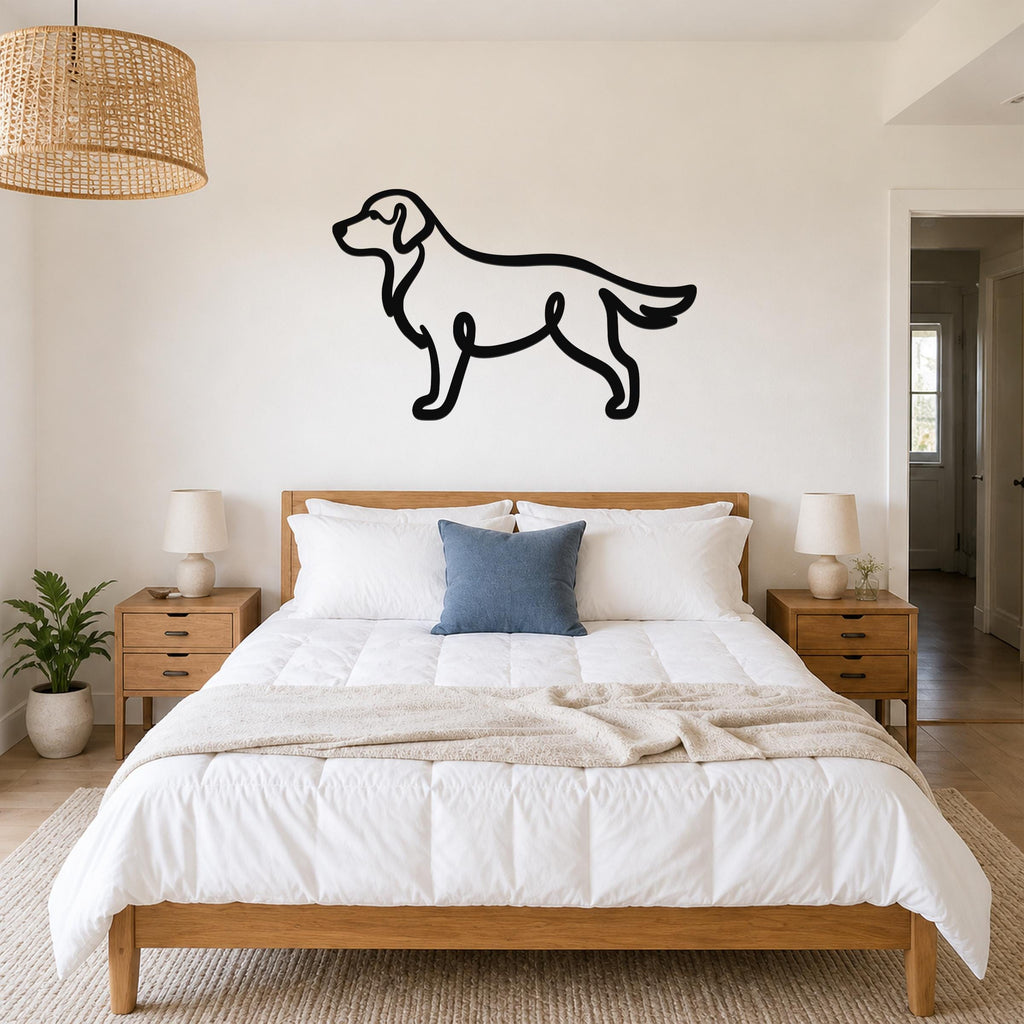 Black metal dog silhouette wall art, a continuous-line design of a standing dog, mounted on a wall above a bed in a bedroom.