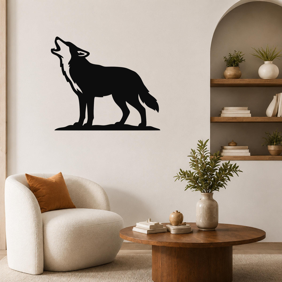 Black metal coyote wall art in a howling silhouette, mounted on a living room wall above a white armchair.