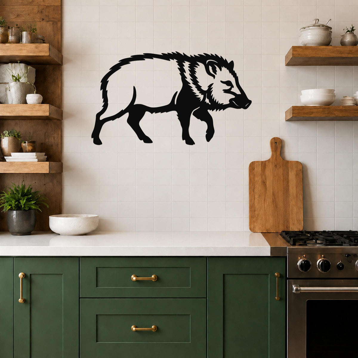 Black metal javelina wall art silhouette mounted on a tiled kitchen wall above a counter, with wooden shelves and green cabinets visible.