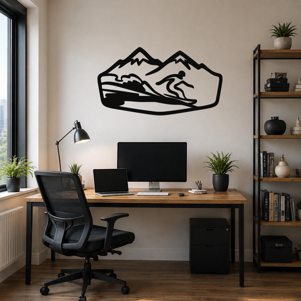 Black metal wall art silhouette of a snowboarder in motion, mounted above a wooden desk in a home office.