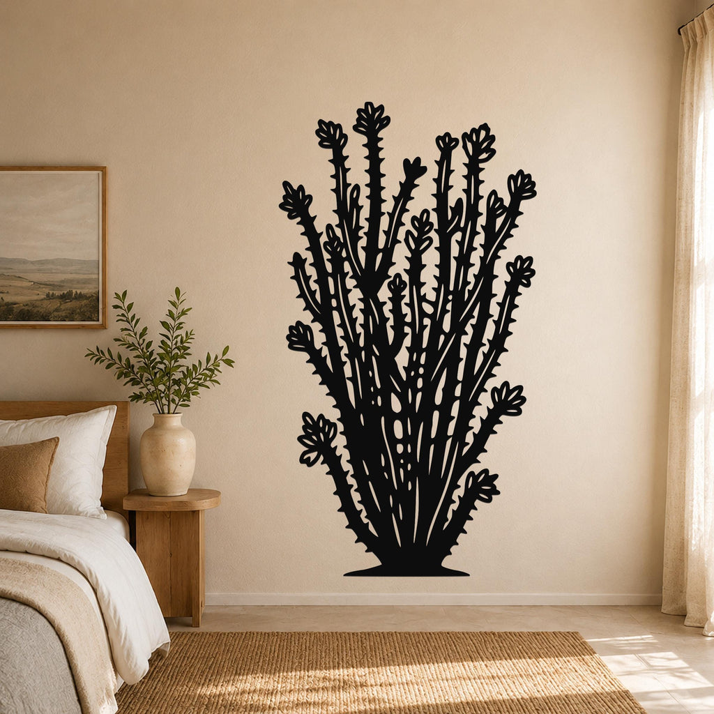 Black metal ocotillo wall art with detailed branch and flower cutouts, mounted on a bedroom wall above a bed.