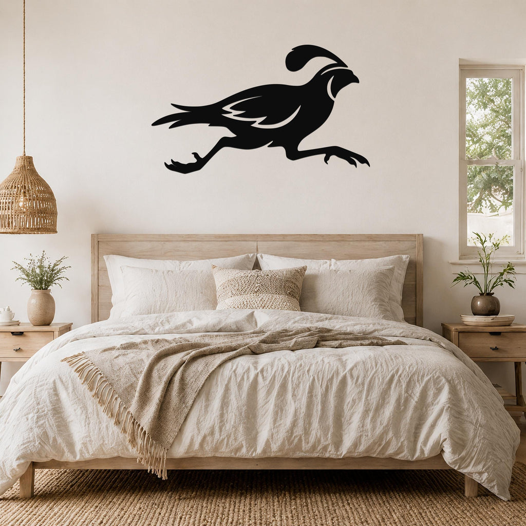 Black metal quail wall art in a running silhouette, mounted above a bed in a neutral bedroom.