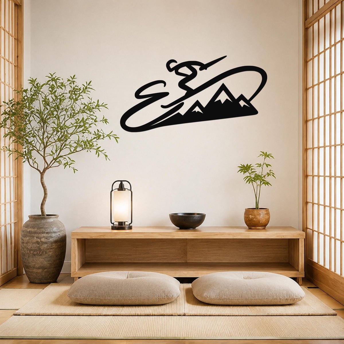 Black metal wall art silhouette of a skier in motion above a mountain range, mounted on a light-colored wall above a wooden console in a minimalist room.