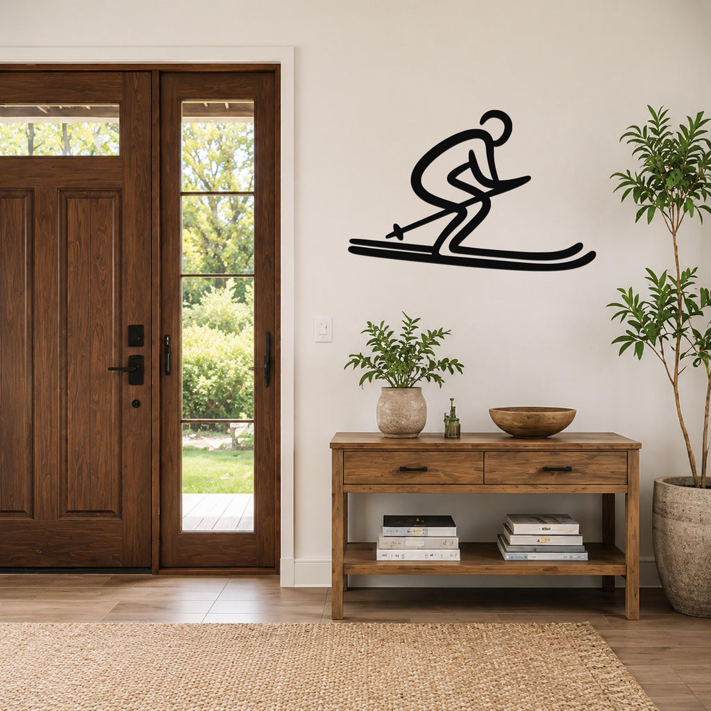 Black metal wall art of a skier silhouette with motion lines, mounted on a living room wall above a wooden console table.