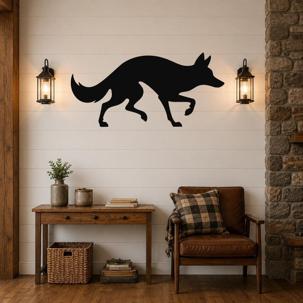 Black metal coyote wall art silhouette mounted on a shiplap wall above a wooden console table in a living room.