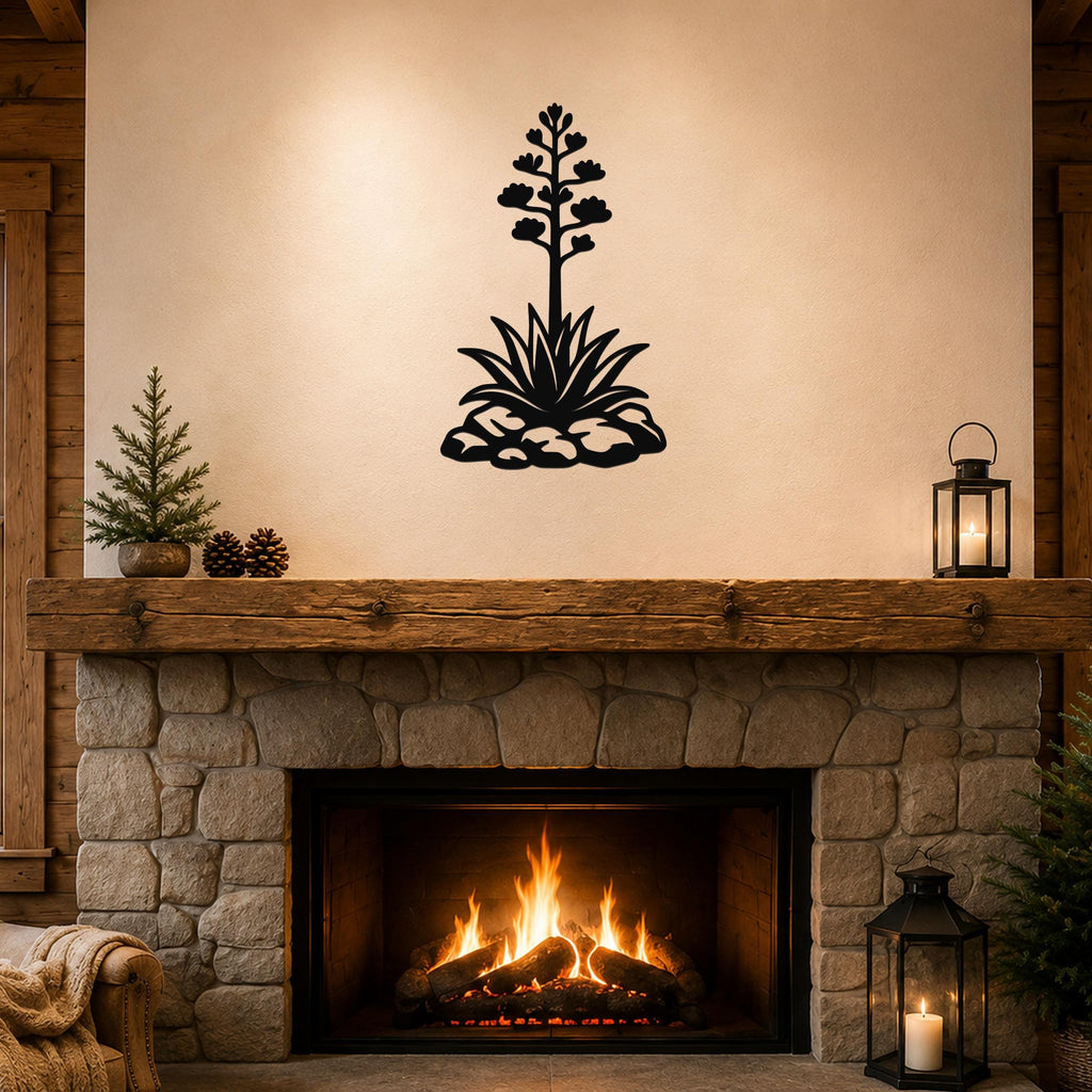 Black metal agave wall sculpture with blooming flower and spiky leaves, mounted above a stone fireplace in a rustic living room.