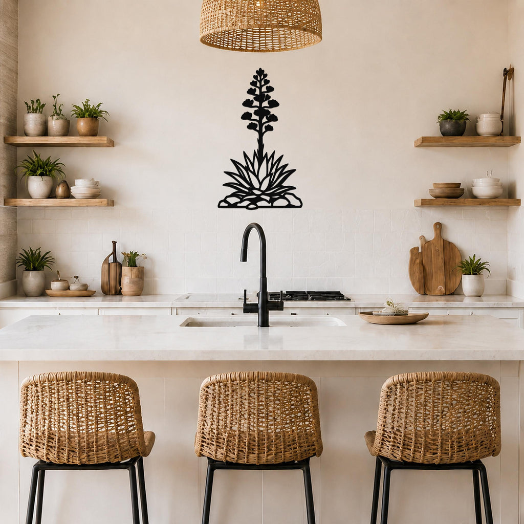 Black metal agave wall art with a blooming flower silhouette, mounted on a kitchen wall above a counter.