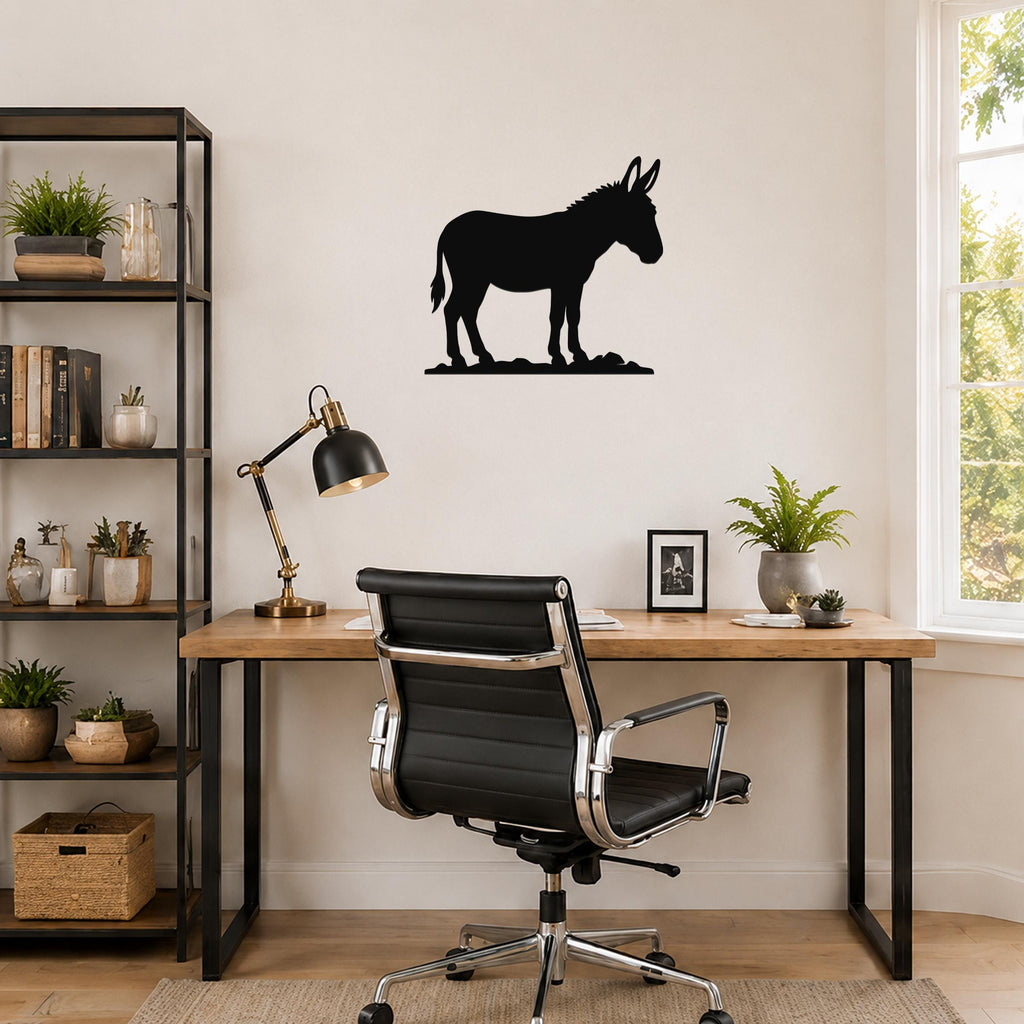 Black metal donkey silhouette wall art mounted on a light-colored wall above a wooden desk in a home office.