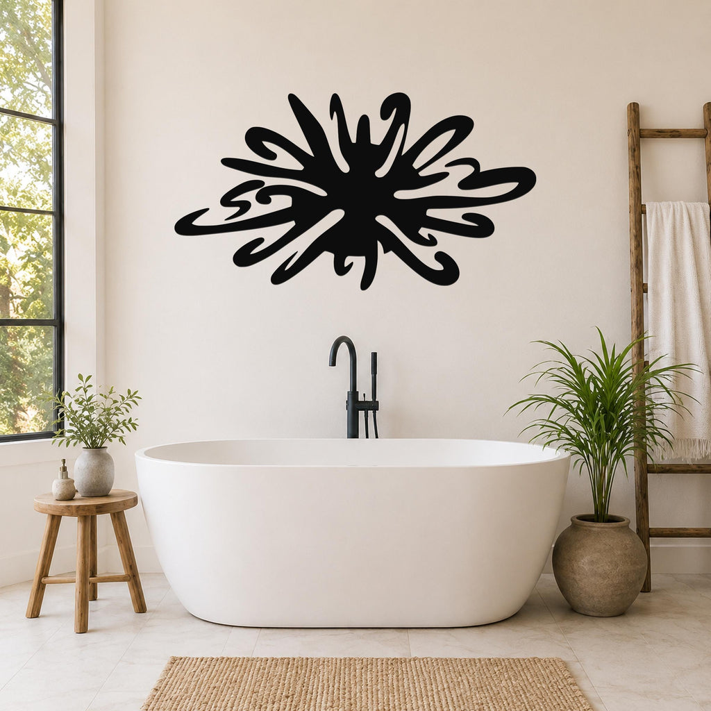 Black metal sea urchin wall art with organic spines and cutout details, mounted on a bathroom wall above a freestanding tub.