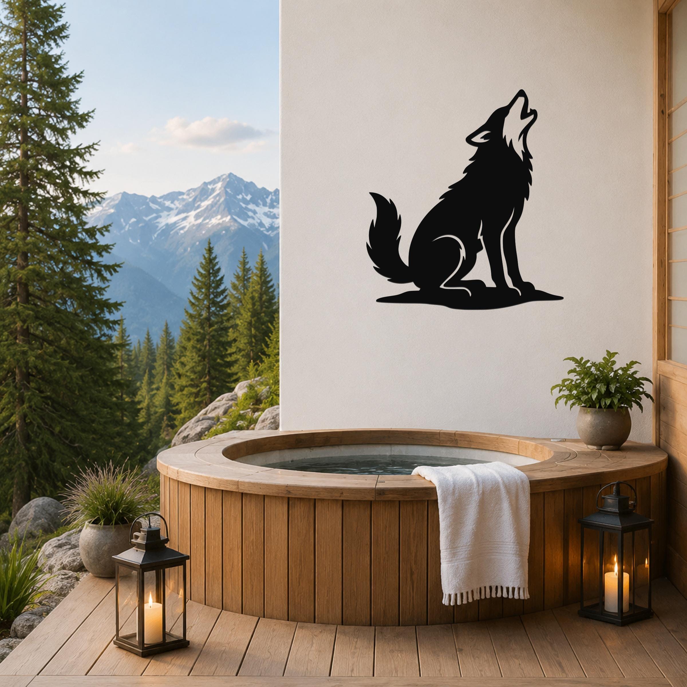 Black metal coyote wall art in a howling silhouette, mounted on a white wall above a wooden hot tub on a mountain-view deck.