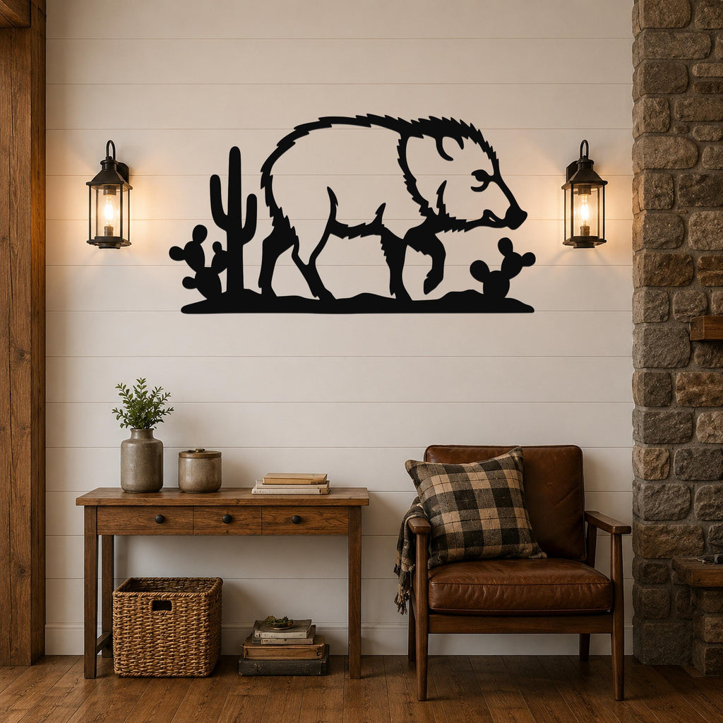 Black metal wall art silhouette of a javelina with cacti, mounted on a shiplap wall above a wooden console table in a living room.