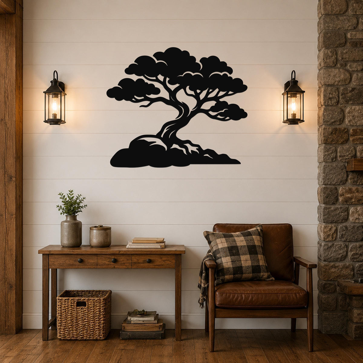 Black metal wall art silhouette of a bonsai-style juniper tree with detailed branches and roots, mounted on a shiplap wall above a wooden console table in a living room.