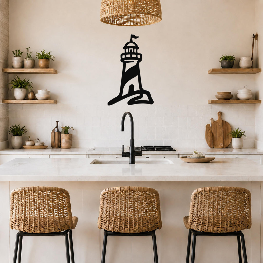 Black metal lighthouse wall art with a silhouette design, mounted on a kitchen wall above a counter.