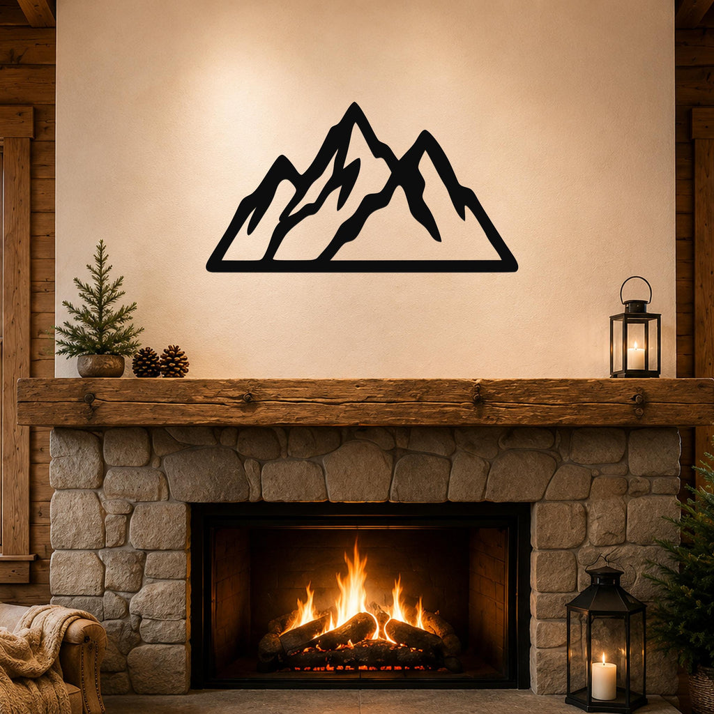 Black metal mountain silhouette wall art with layered peaks, mounted above a stone fireplace in a rustic living room.