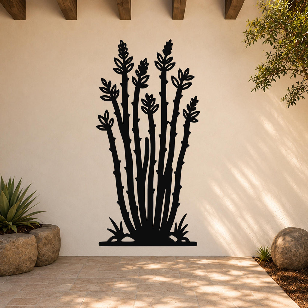Black metal wall art cutout of an ocotillo plant with spiny stems and leaf clusters, mounted on a light-colored outdoor wall above a tiled patio.
