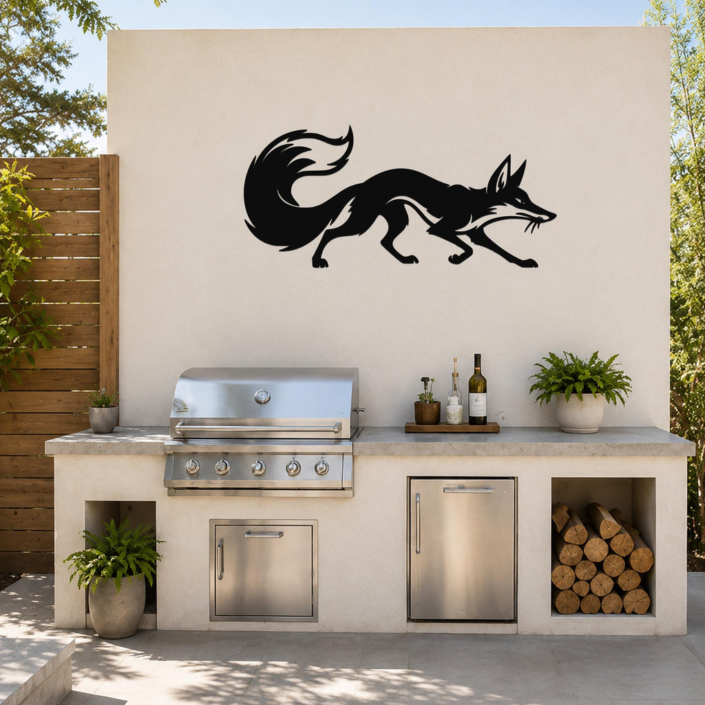Black metal fox wall art silhouette with motion lines, mounted on an outdoor kitchen wall above a stainless steel grill.