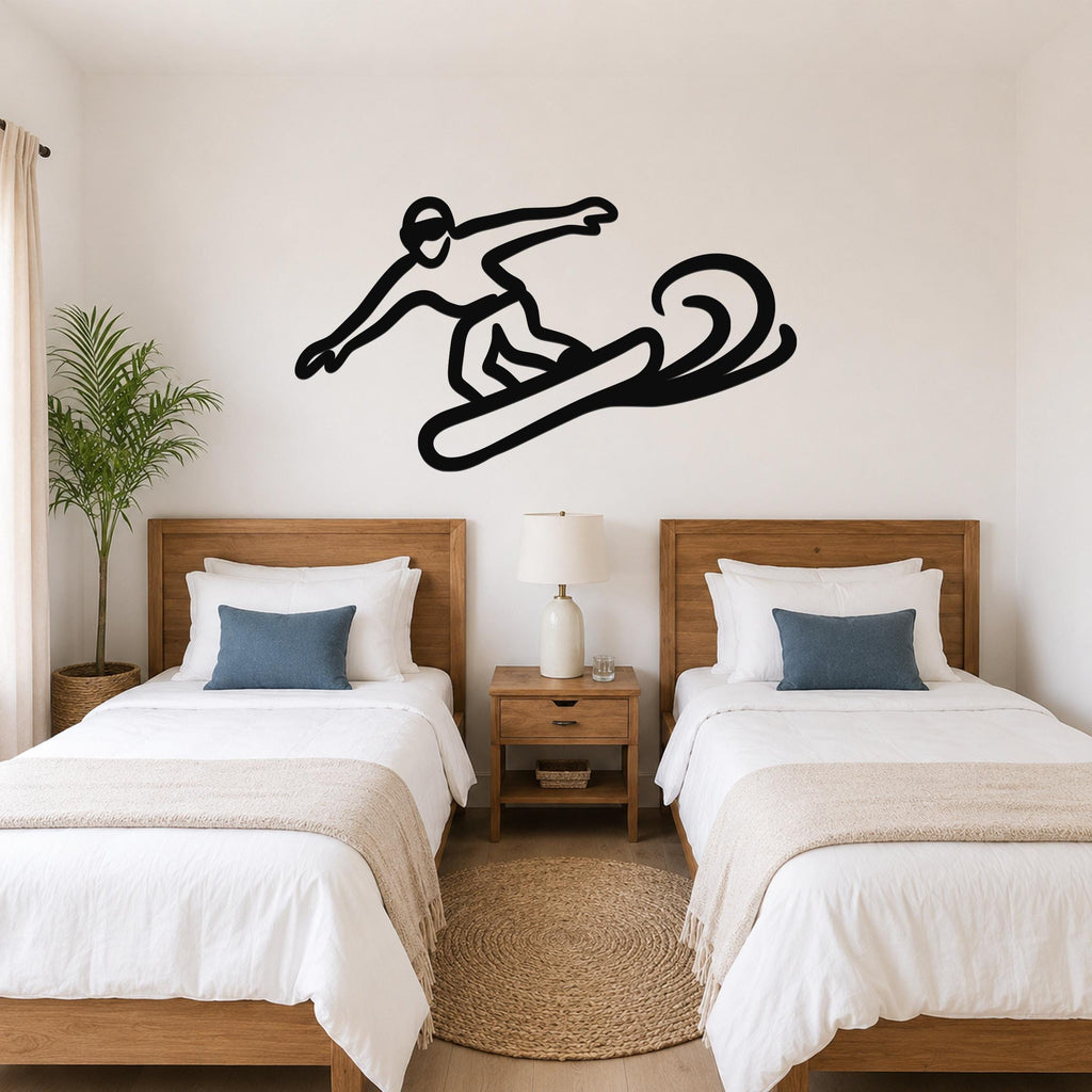 Black metal snowboarder silhouette wall art with motion lines, mounted above two beds in a bedroom.