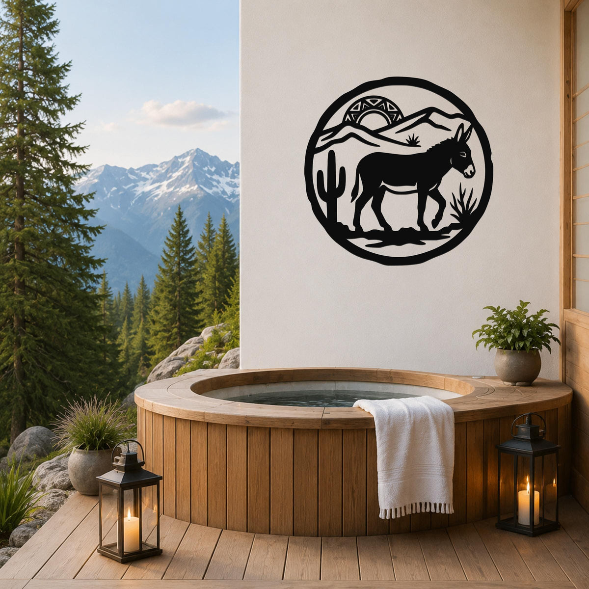 Black metal wall art featuring a burro silhouette in a desert scene with cactus and mountains, mounted on a white wall above a wooden hot tub on a deck.