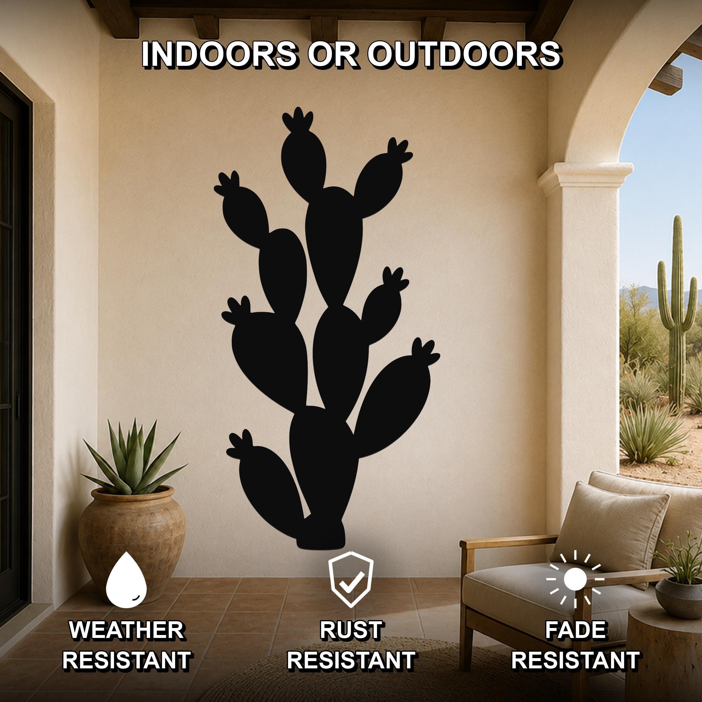 Black metal prickly pear cactus wall art silhouette mounted on a beige outdoor patio wall, weather resistant, rust resistant, and fade resistant.