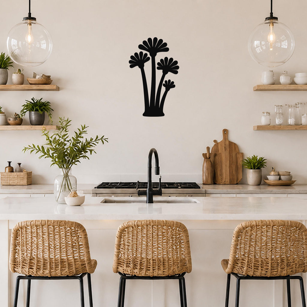 Black metal wall art featuring a fan palm tree silhouette with multiple fronds, mounted on a kitchen wall above a counter.