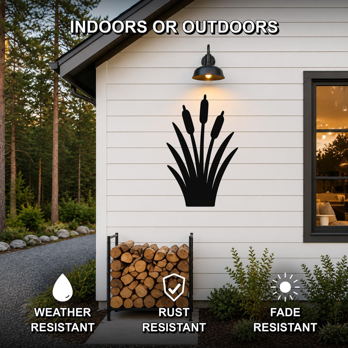 Black metal cattail wall art silhouette mounted on a white exterior wall above a firewood rack, with text indicating it is weather, rust, and fade resistant for indoor or outdoor use.