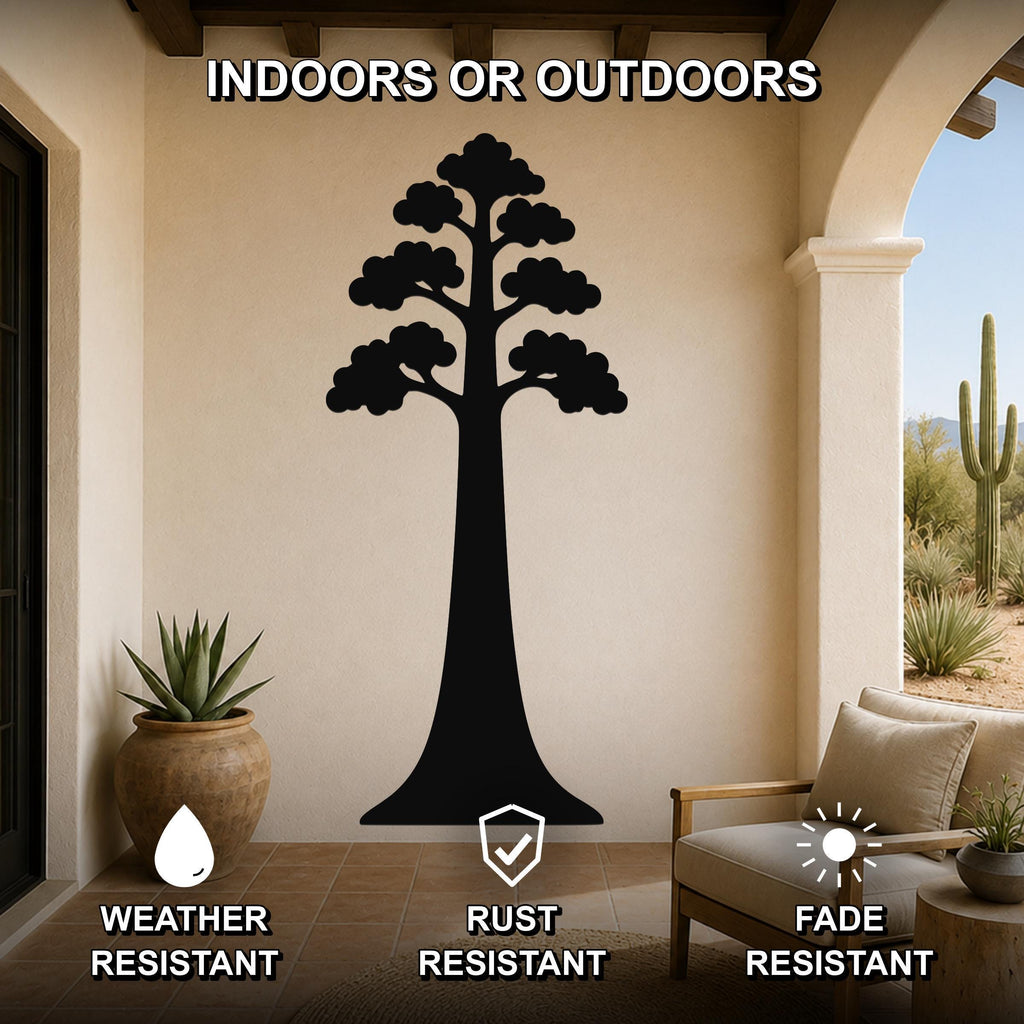 Black metal sequoia tree wall art with layered branch cutouts, mounted on a beige outdoor patio wall above a wooden chair and potted succulent.