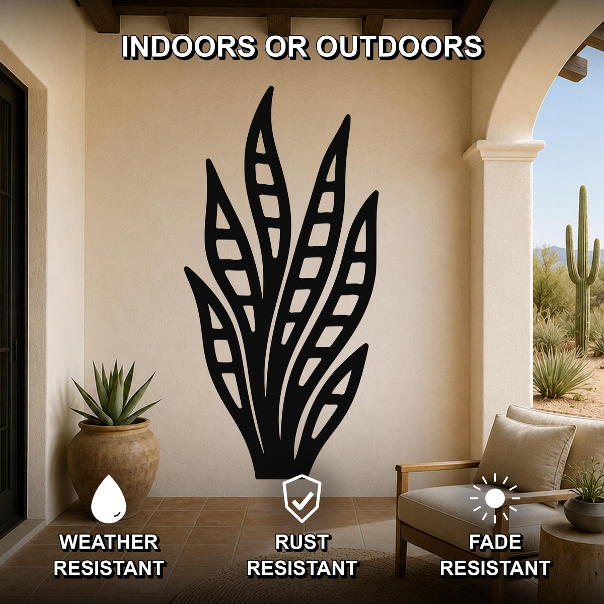 Black metal snake plant wall art with leaf cutouts, mounted on a beige outdoor patio wall above a chair and potted plant.