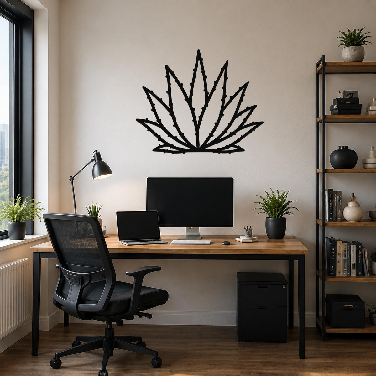 Black metal agave wall art with spiky leaf cutouts, mounted above a wooden desk in a modern home office.
