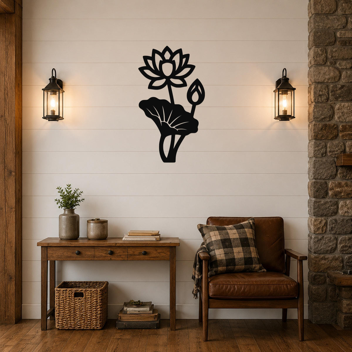 Black metal lotus flower wall art with a large bloom and leaf cutout, mounted on a shiplap wall above a wooden console table in a living room.